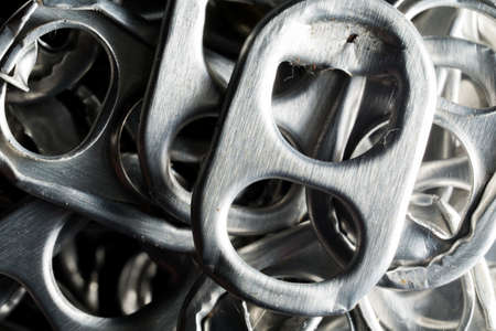 a lot of old aluminium crown cap with lighting.の写真素材