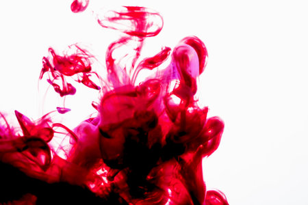 selective soft focus red liquid like blood drop in to clear water