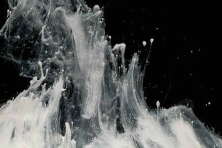 Abstract paint splash isolated on black background. Cloud of ink in water.の写真素材