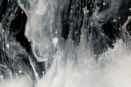 abstract background of acrylic paint in water isolated on black background.の写真素材