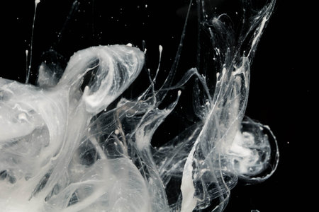 abstract ink splash in water isolated on black background, abstract backgroundの写真素材