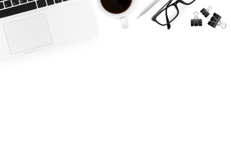 Laptop and supplies isolated on white background. Top view with copy space, flat lay.の写真素材