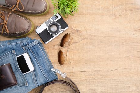 Hipster travel accessories including a retro film camera. Top view with copy space, flat lay.の写真素材