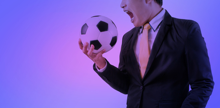 Double exposure of Business holding football Purple abstract backgroundの写真素材