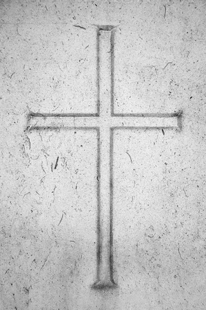 Religion conceptual image  Cross carved in stoneの写真素材