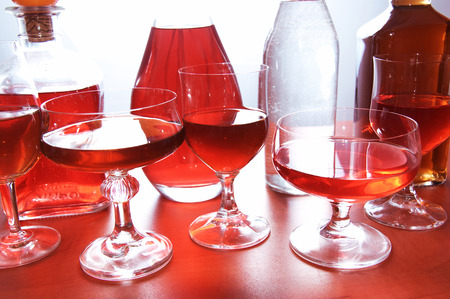 Alcohol conceptual image  Glasses and bottle of wine and whisky on isolated background の写真素材