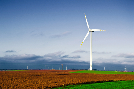 Windmill on the field. Alternative energy.