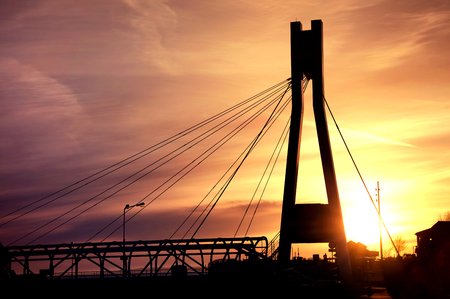 Architecture. Bridge construction against evening sky and sundown.の写真素材