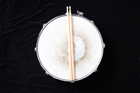 Drums conceptual image. Snare drum and stick over black background.の写真素材