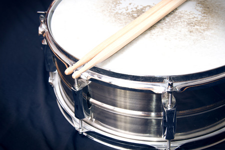 Drums conceptual image. Snare drum and stick over black background.の写真素材