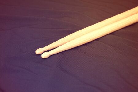 Drums conceptual image. Drumsticks over dark background.の写真素材