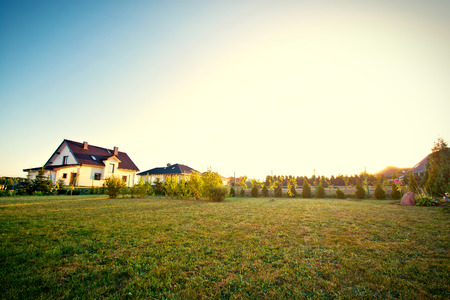 Typical backyard with garden and green grass.の写真素材