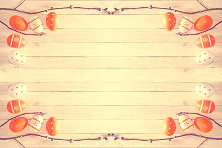 Easter eggs on wooden background. Soft vintage pastel colors picture.