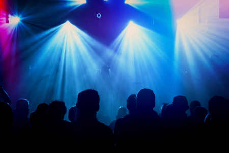 Rock band silhouettes on stage at concert. Abstract image.の写真素材