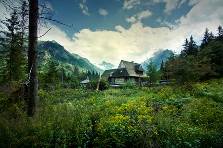 Nature in mountains. Old wooden house in beautiful mountains scenery.の写真素材
