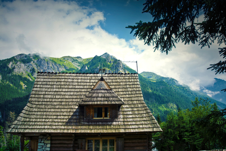Nature in mountains. Old wooden house in beautiful mountains scenery.の写真素材