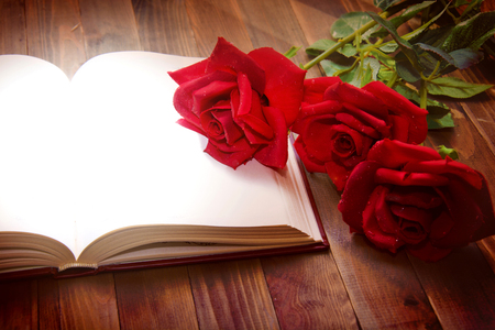 Open book on wooden table. Knowledge and education conceptual image.の写真素材