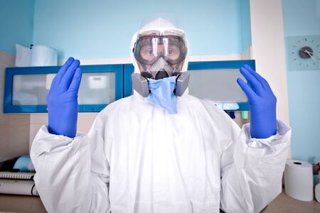 Doctor in protective suit uniform and mask. Coronavirus outbreak. Covid-19 concept.の写真素材