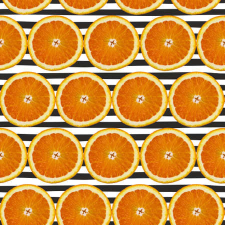 Creative pattern made of orange on black striped. Food concept