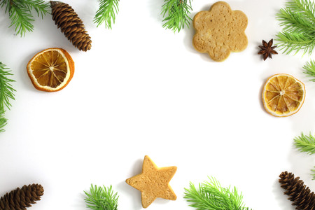 Christmas composition. Christmas frame of fir branches cinnamon, orange and star anise. Christmas Wallpaper. Flat position, top viewの写真素材