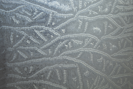 Ice patterns on winter glassの写真素材