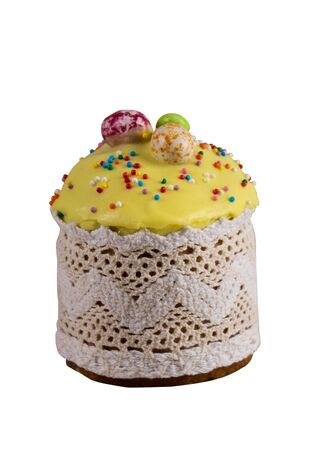 Festive cupcake for Easter with candy decoration and topping. Isolated on a white background