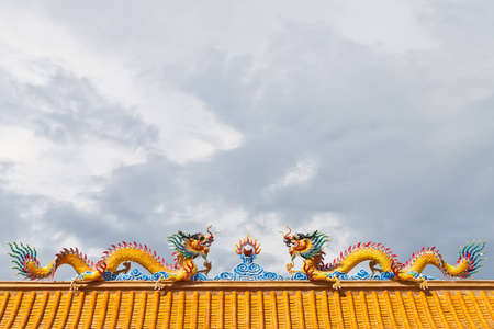 Two dragon with sun on top of roof  の写真素材