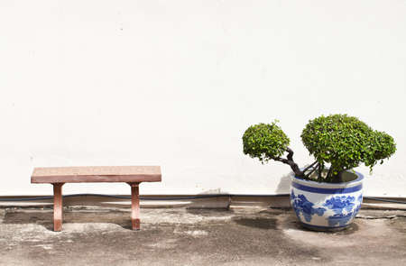 Stone chair with big vase の写真素材