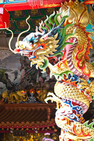 Colourful dragon on pole in chineses church の写真素材
