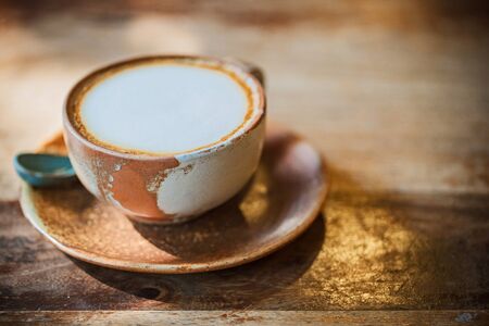 Vintage coffee cup on wood table