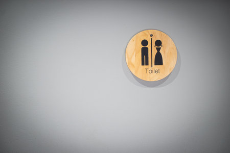 Toilet sign on wallの写真素材