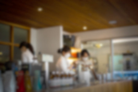 Abstract blurred coffee shop with baristaの写真素材