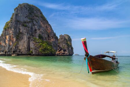 Thai traditional boat and beautiful sand beach at Krabi province, Thailand.の写真素材