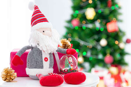 Merry Christmas and Happy Holiday-Santa Claus doll and decoration with Christmas tree background.の写真素材