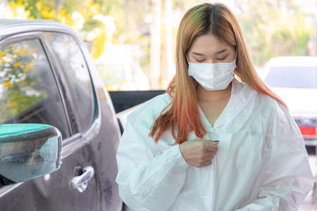 Female doctor or nurse wearing protective suit. Outbreak COVID-19, Medical, Healthcare and Quarantine concept.の写真素材
