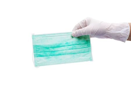 Hand holding medical mask, Doctor mask on white background