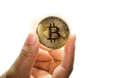 Hand holding Gold bitcoin on white background