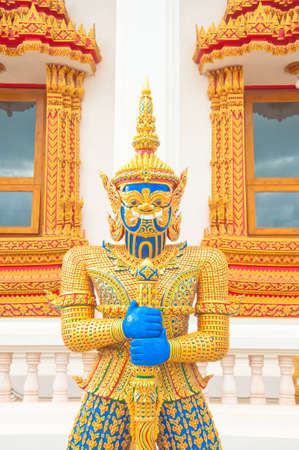 blue face  giant statue guard with weaponの写真素材