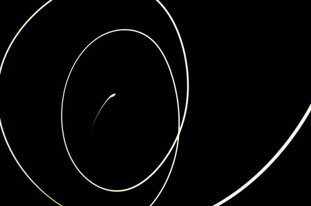 white light long exposure, white light line on black backgroundの写真素材