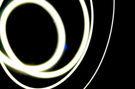 white light long exposure, white light line on black backgroundの写真素材