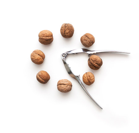 whole walnuts circle shape and tongs