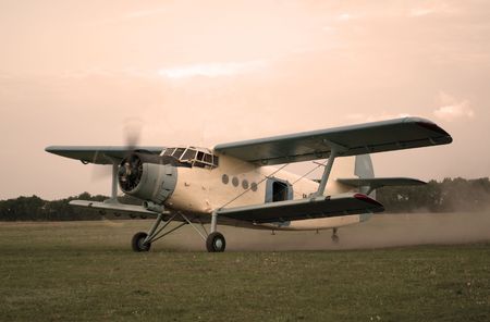 Old style plane flies up to skyの写真素材