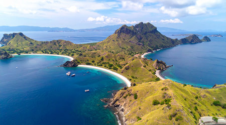 Aerial view of beautiful tropical island with white sand beach and turquoise sea waterの素材