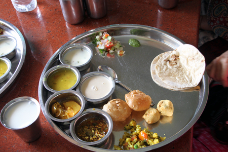 Indian vegetarian lunch served very hot and is too tempting