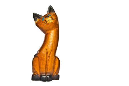 The wooden carving cat on white backgroundの写真素材