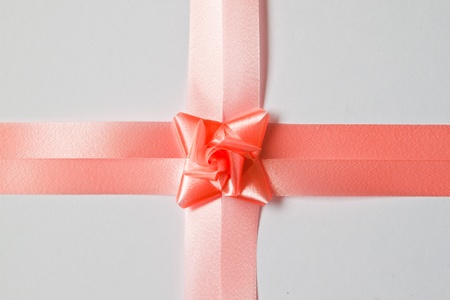 Beautiful pink bow on white backgroundの写真素材