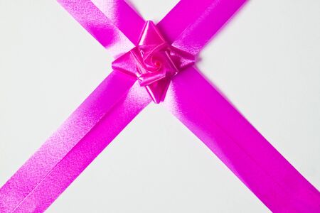 Beautiful purple bow on white backgroundの写真素材