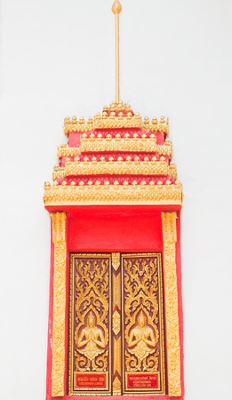 Golden Wood Carving ,Traditional Thai Style at the window of church in Thai Temple.の写真素材