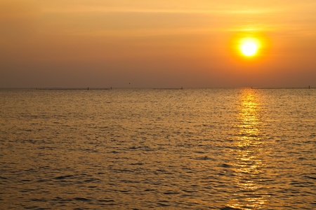 Sunset at coast of the sea