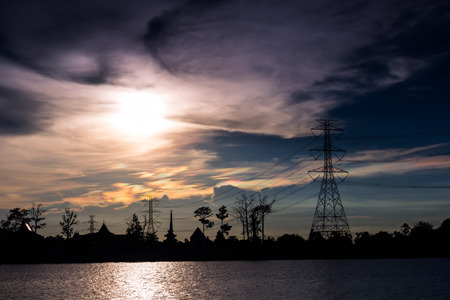 Electricity Pillars against clouds stormの写真素材